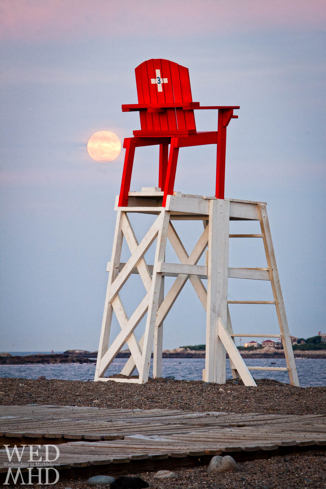 The Sturgeon Moon rises over Devereux Beach