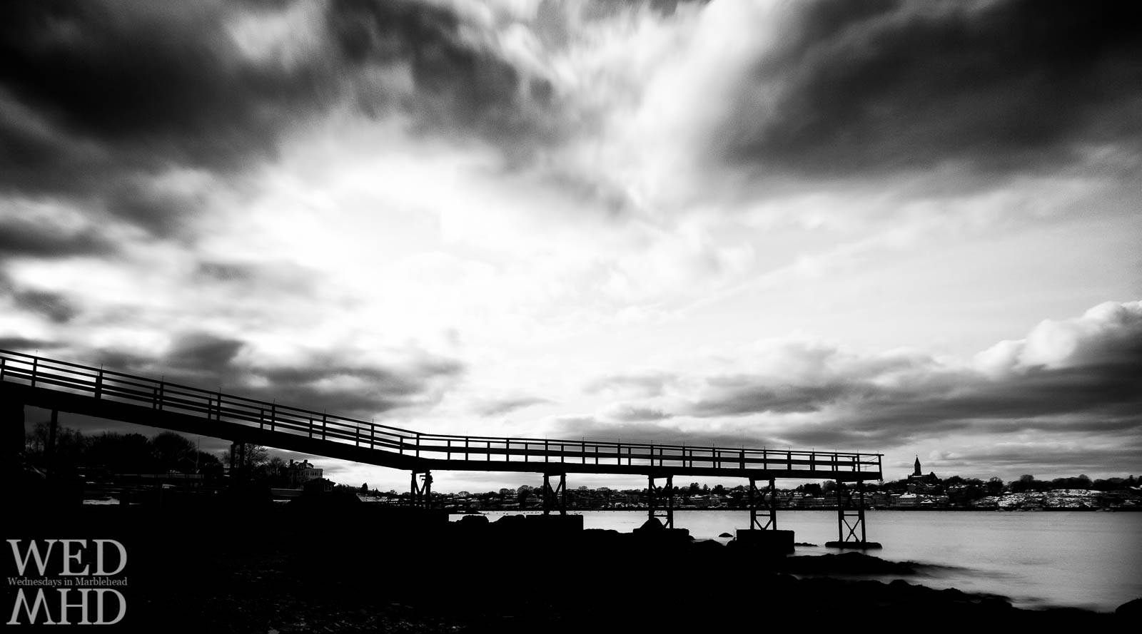A dramatic view of a pier on the Neck