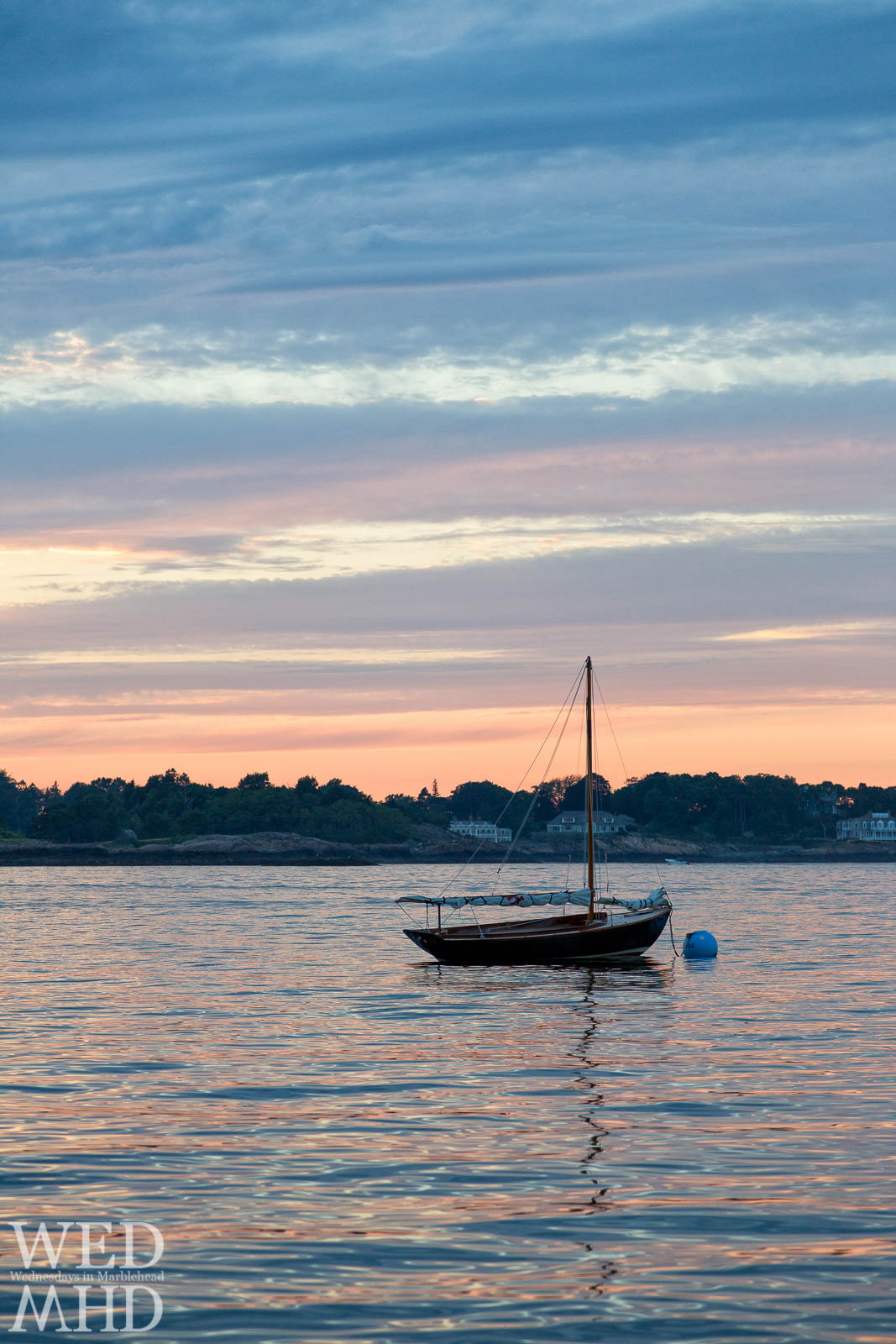 Lone Sailboat in the Harbor