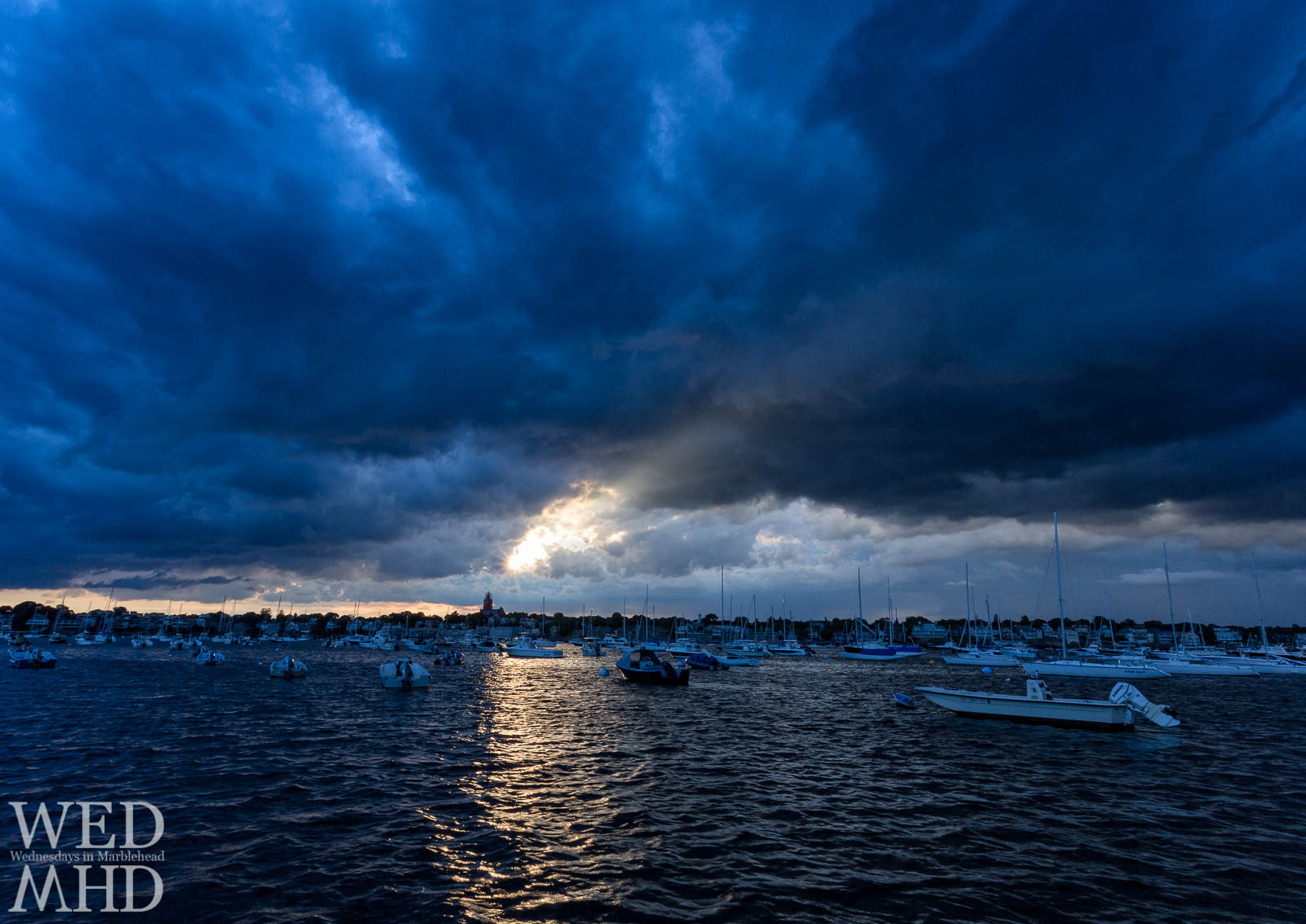light shinging through dark blue clouds