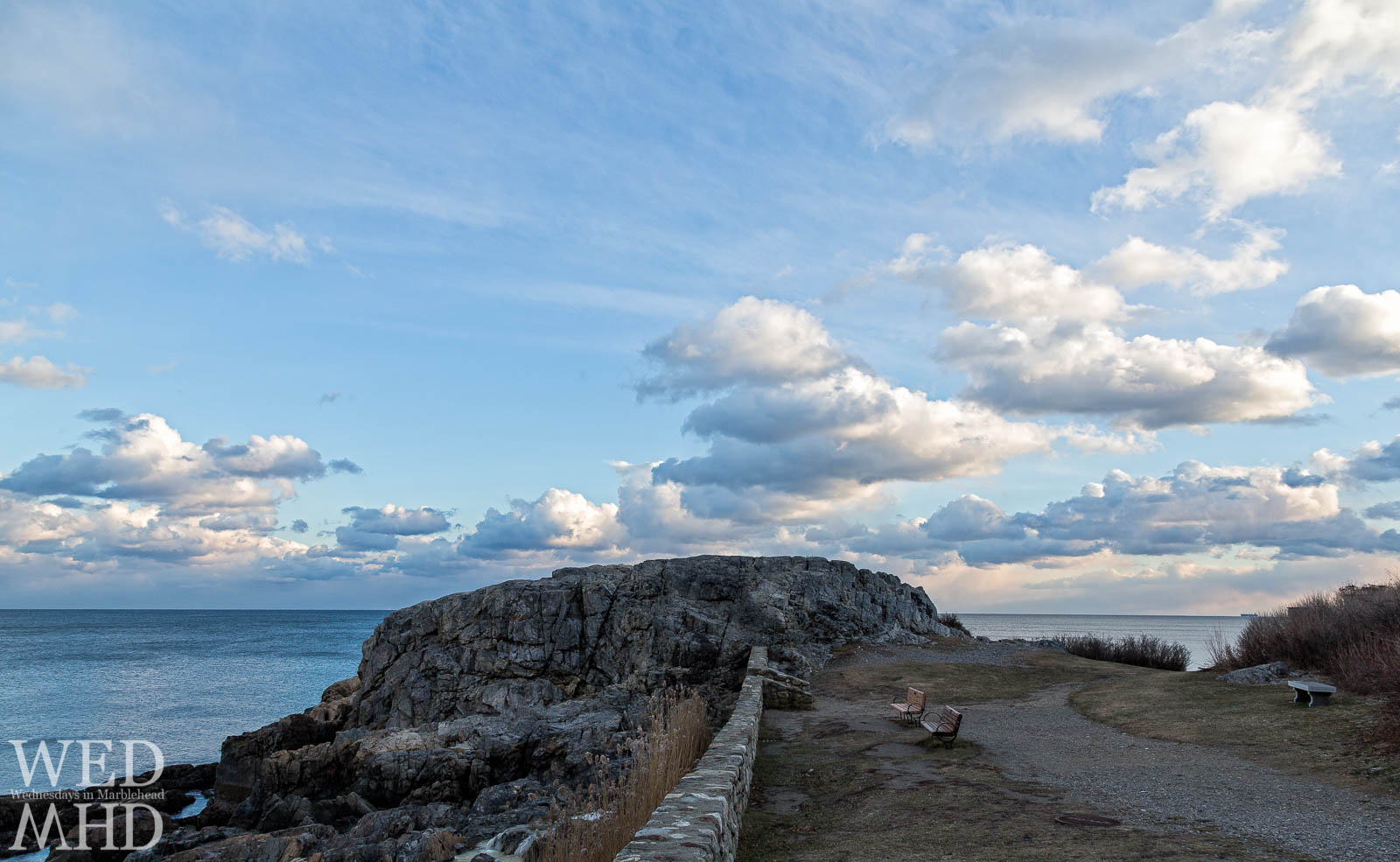 view of Castle Rock in Marblehead under clouds near sunset