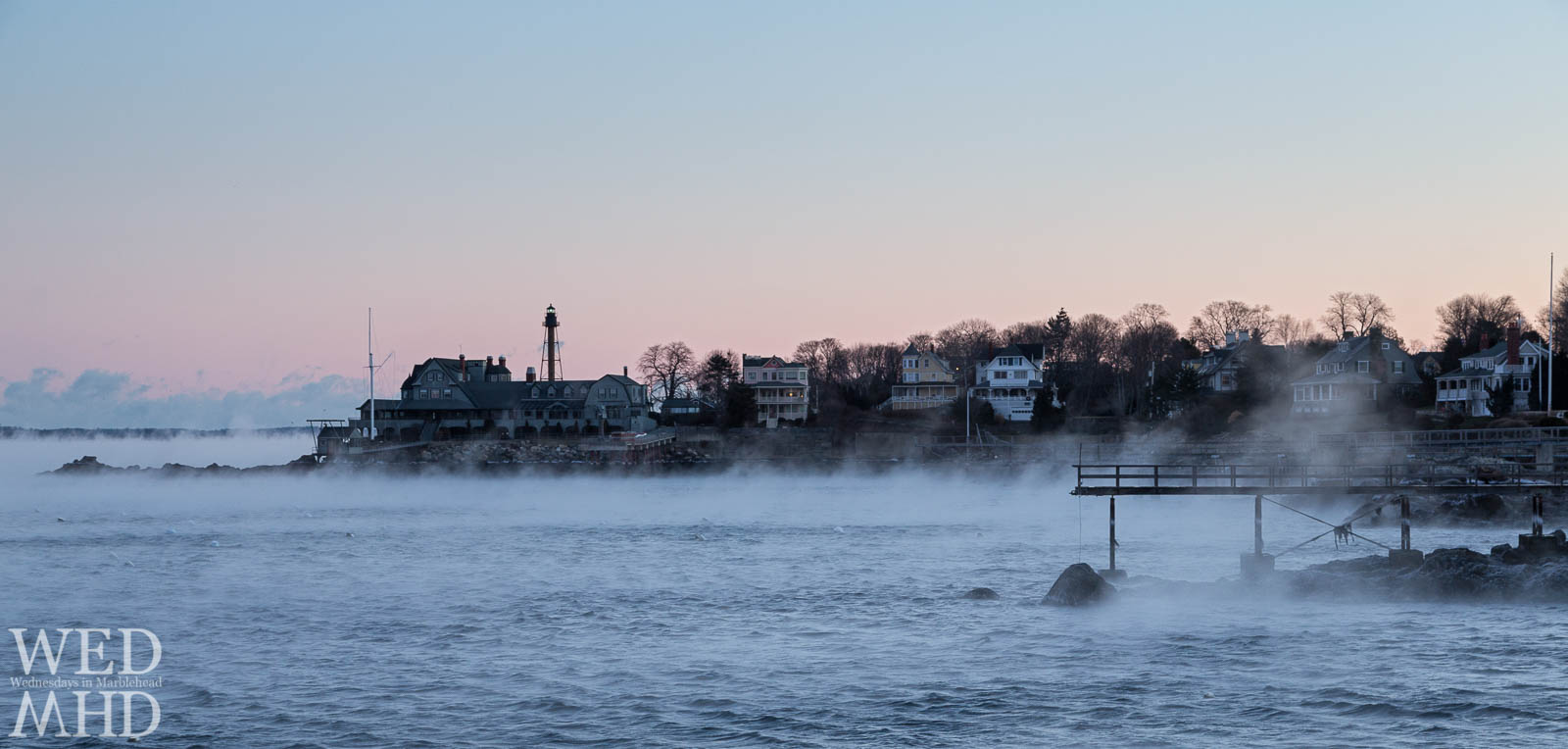 sea smoke in Marblehead harbor with lighthouse