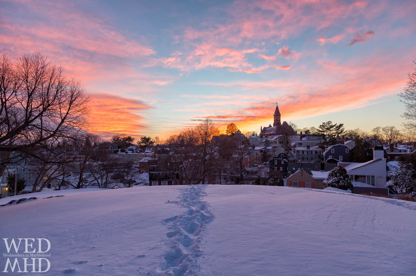 Snow reflects sunset's colors at Crocker Park