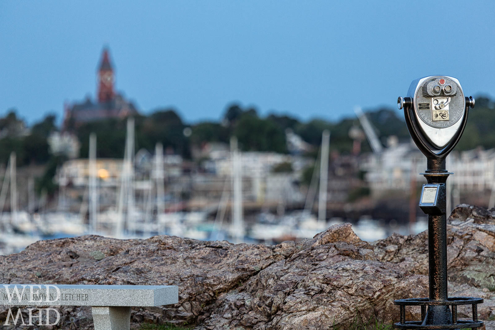 A binocular at Chandler Hovey Park imprinted with the words Turn to Clear Vision offers a great view of Abbot Hall and Marblehead Harbor