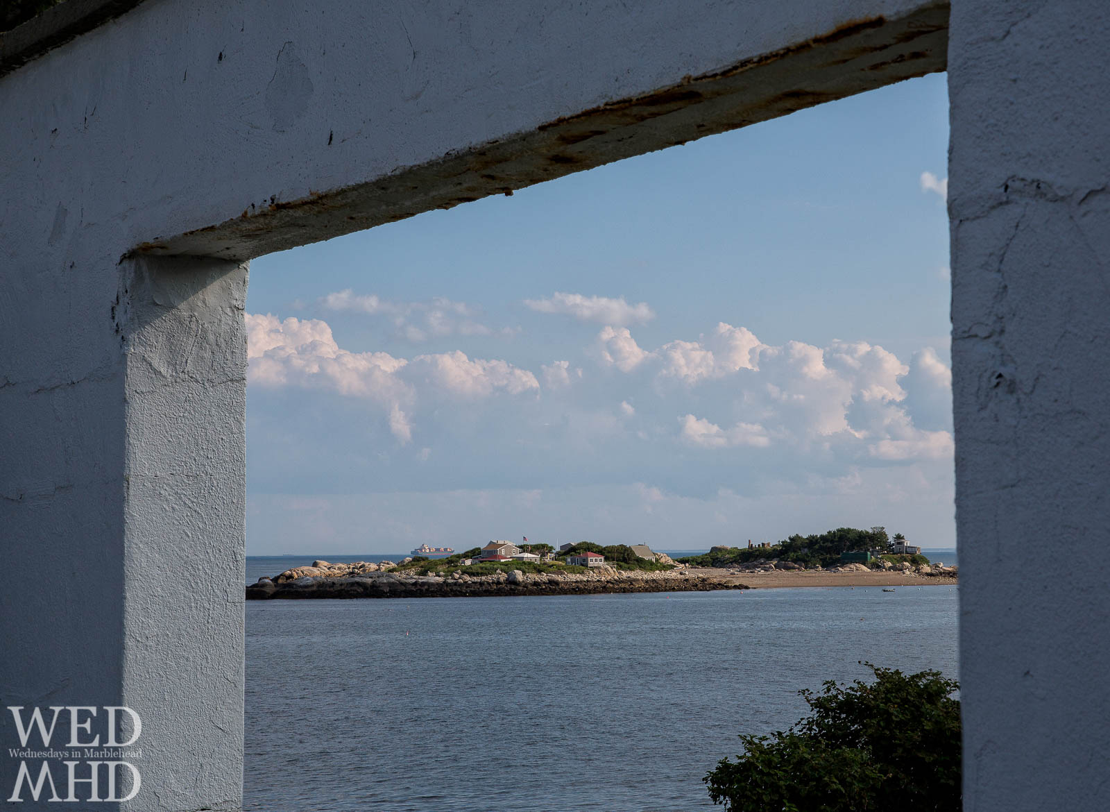 An archway frames this view of Tinker's Island
