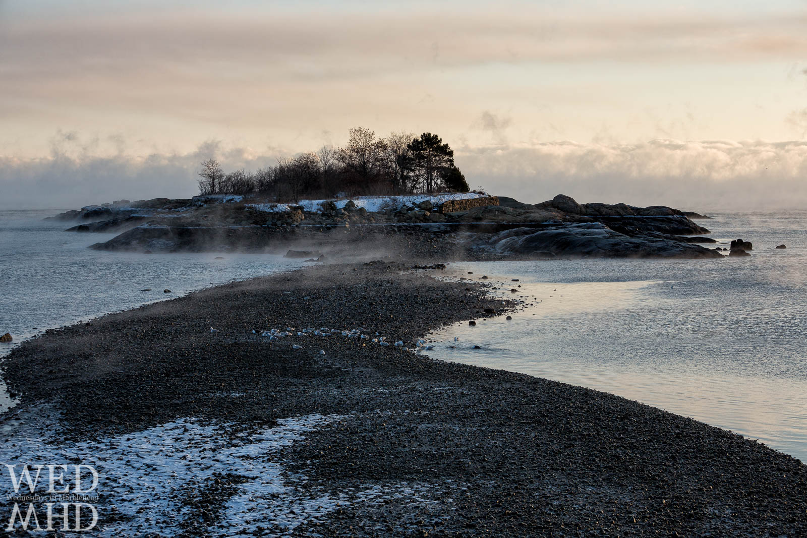 Gerry Island is bathed in sea smoke on an arctic morning in Marblehead