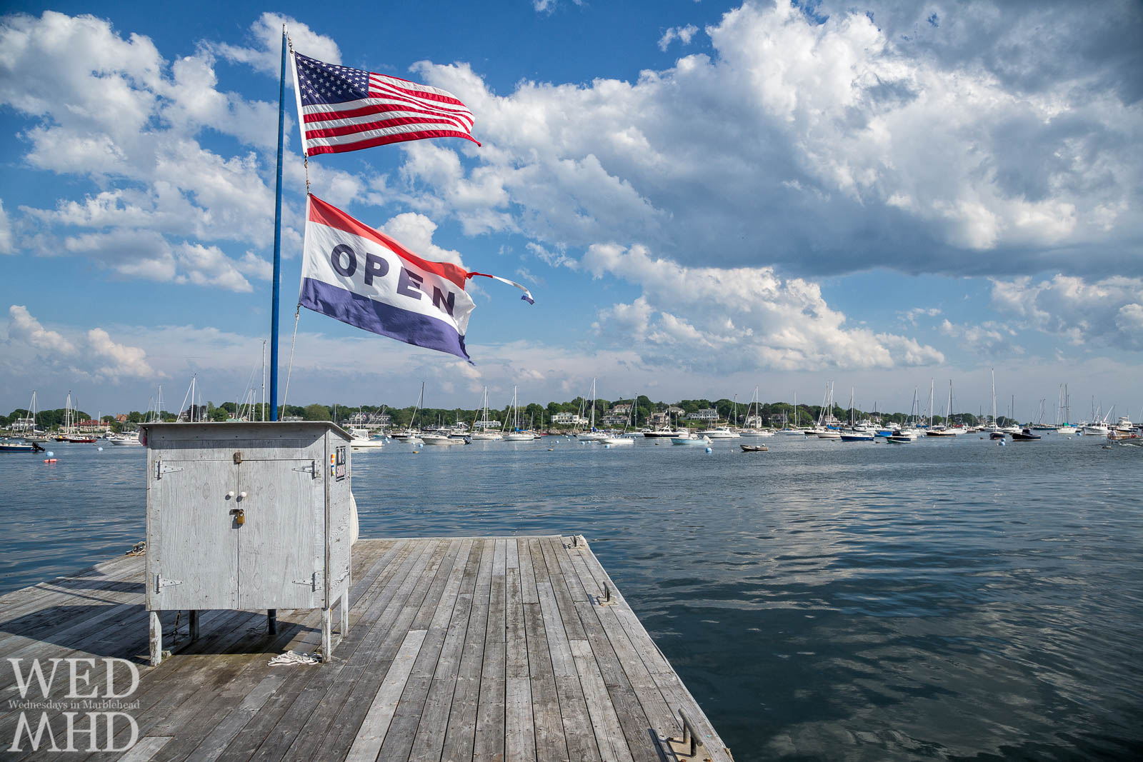 A flag proclaims Marblehead harbor is open for the season