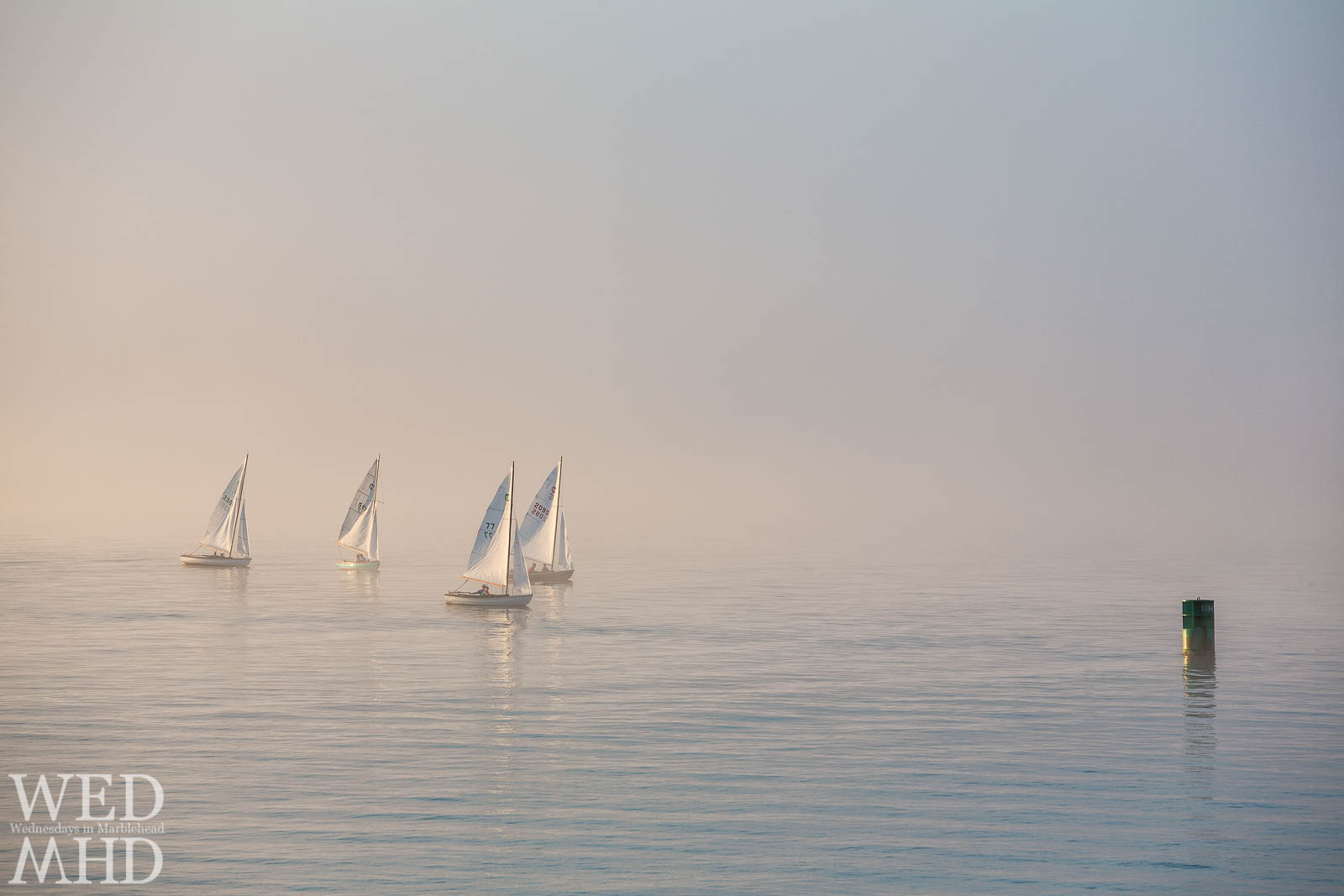 Fine art photograph of town class boats racing toward the MH1 marker in Marblehead Harbor