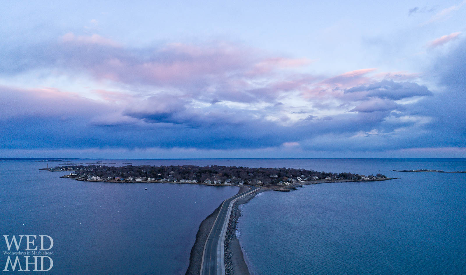 Aerial view of sunset on the neck captured from above the causeway on a early March evening