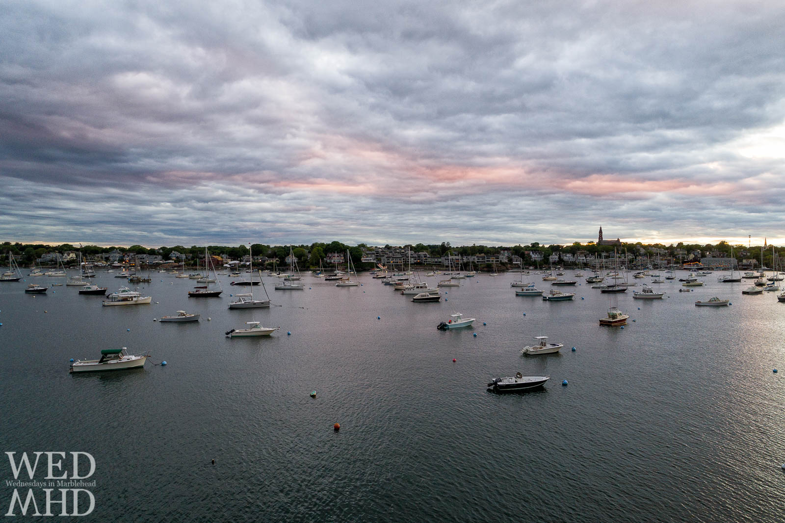 A Marblehead sunset captured from the air is compared to one shot from land along Parker Lane on an early June evening