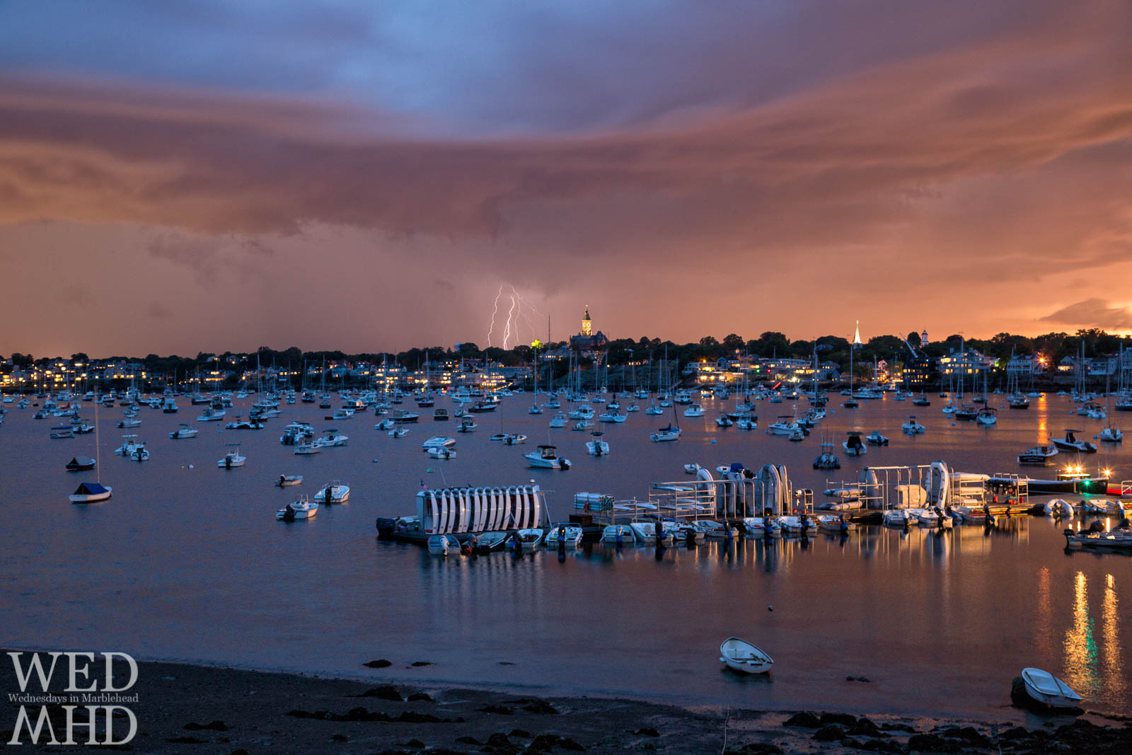 Strings of lightning captured during a storm showcase Mother Nature's fireworks against Abbot Hall and Marblehead Harbor