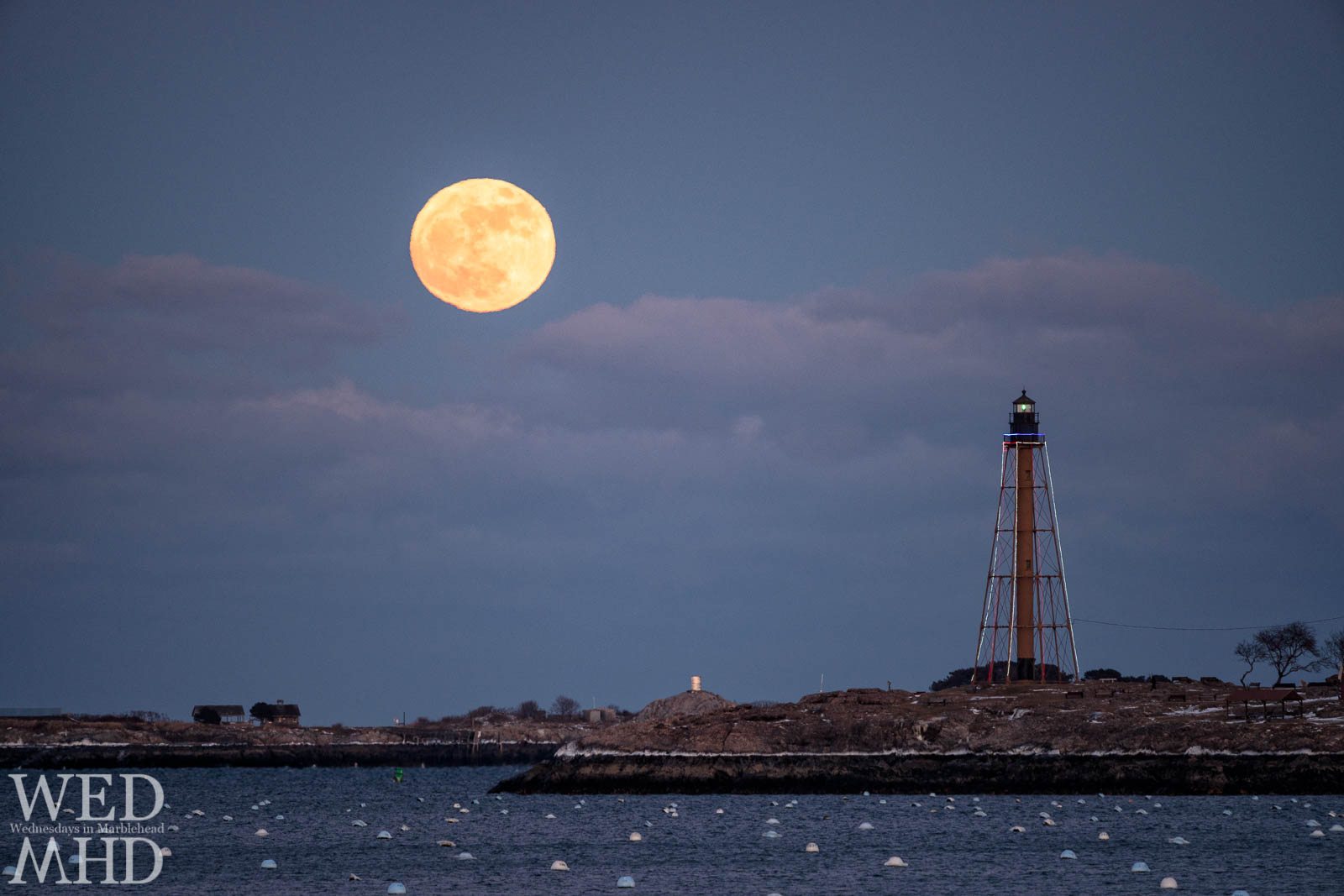 The New Years Supermoon rises over Chandler Hovey Park and Marblehead Light on an arctic start to 2018.