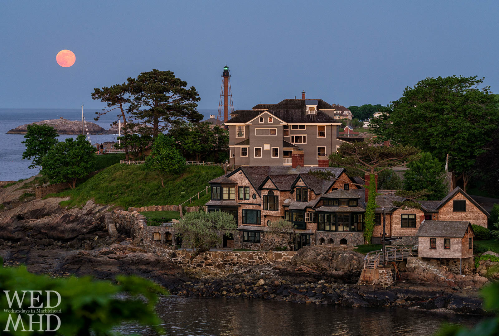 The full flower moon rises over Marblehead Rock as seen from Fountain Park