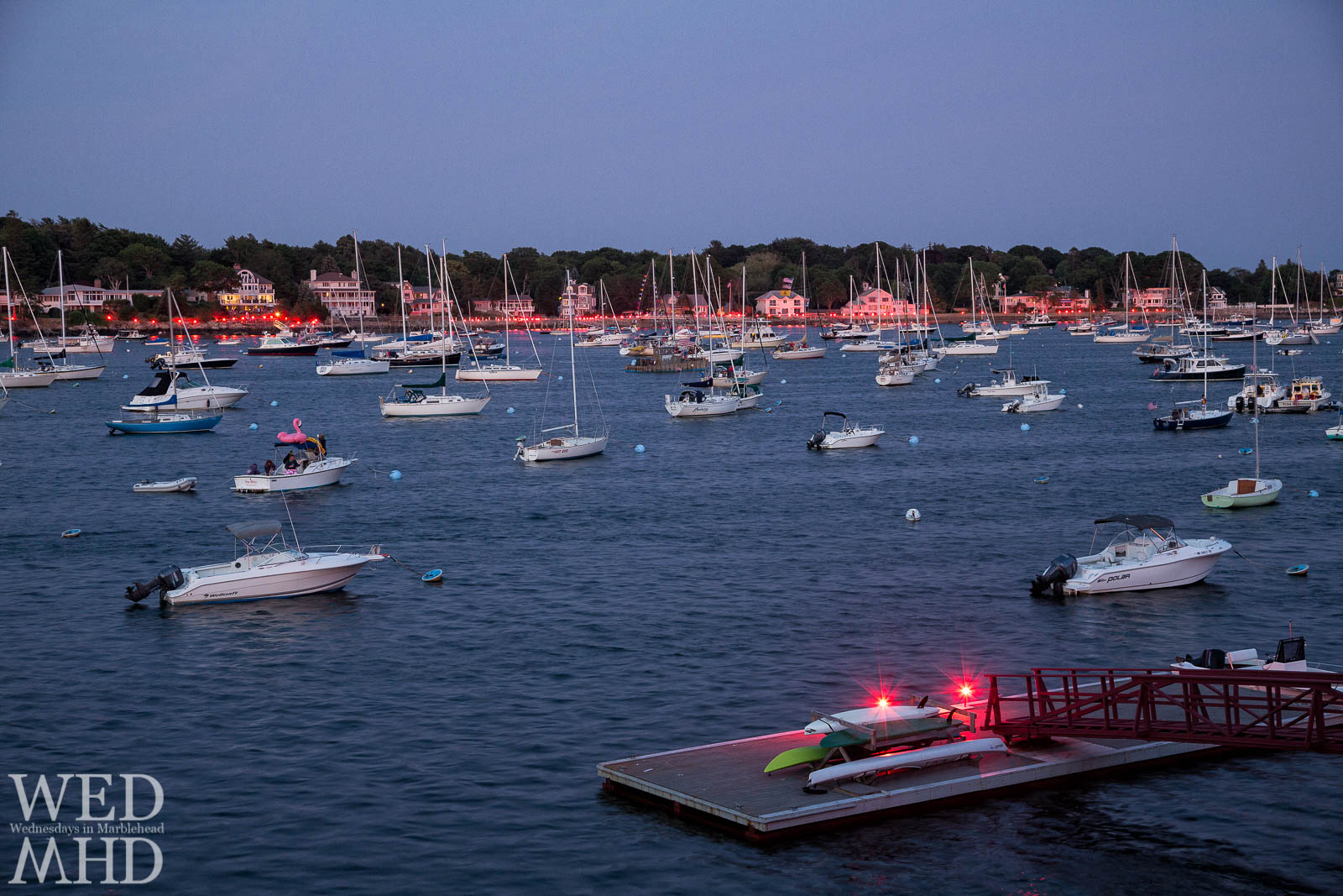 The annual Harbor Illumination takes place on the Fourth of July with lit flares around the harbor setting the scene for the fireworks show