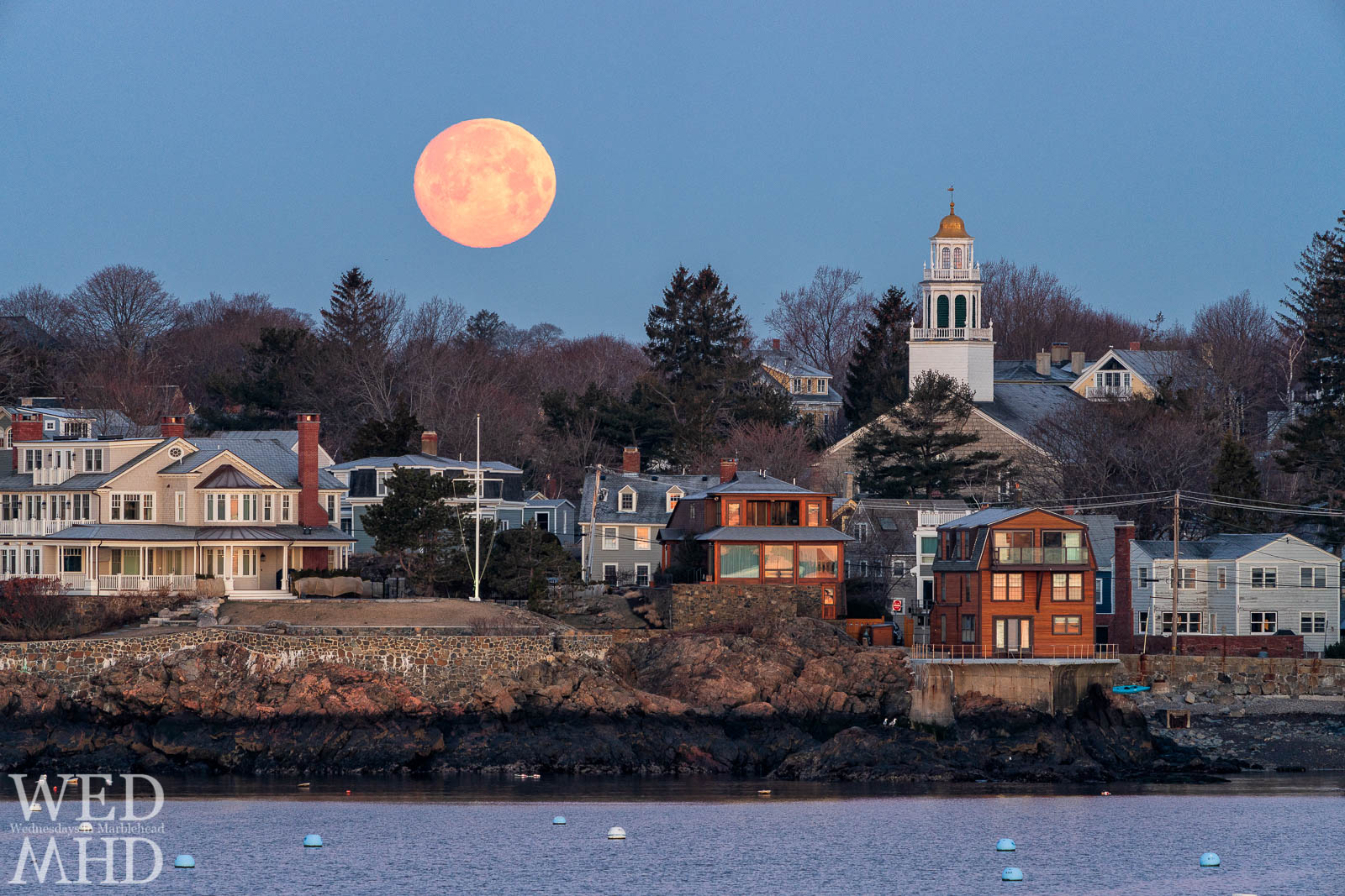 The full vernal worm moon sets beside Old North Church in Marblehead
