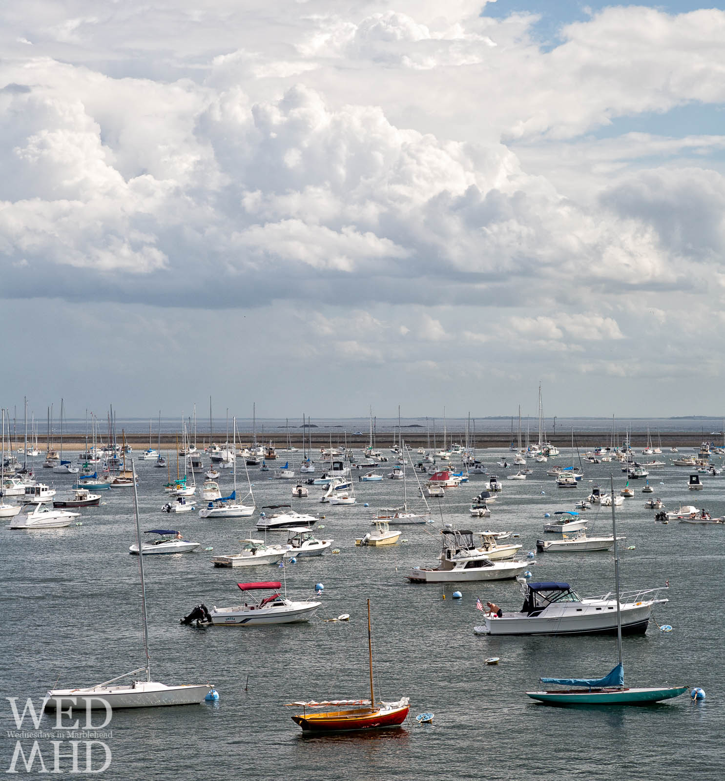 A view of boats morred in inner harbor looking out toward the causeway from Crocker Park in Marblehead