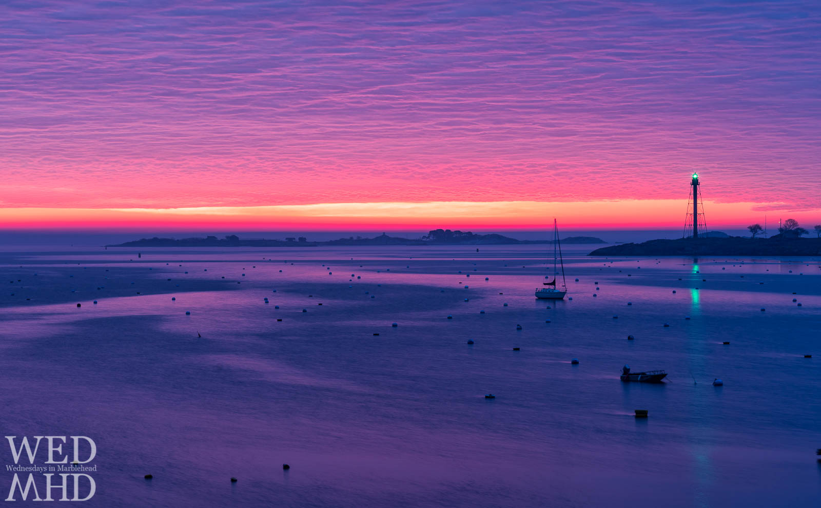 An early morning wakeup results in witnessing and capturing a corker of a sunrise with a loan boat in Marblehead Harbor bathed in purple light