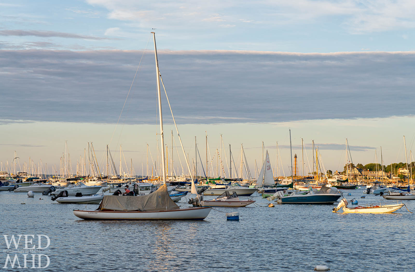 Golden sunlight reflects off boats filling Marblehead Harbor on this Labor Day weekend