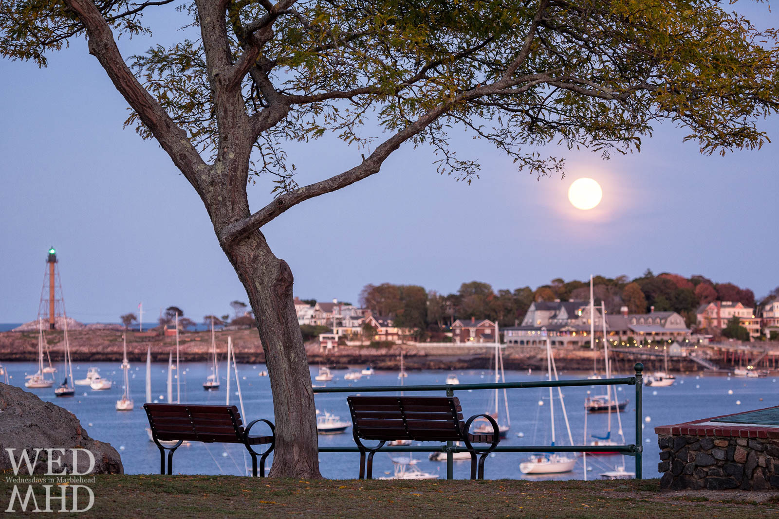The full Hunters moon rises over the Eastern Yacht Club as seen from Crocker Park