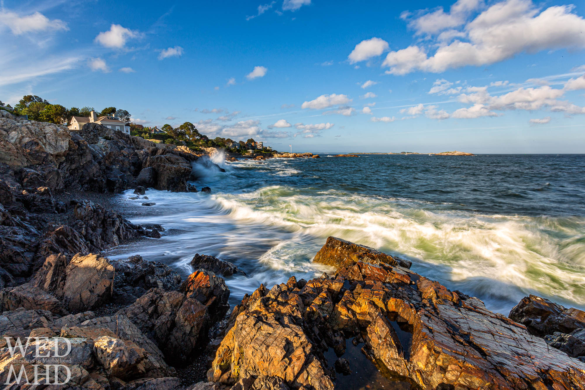Receding waves form white lines at Castle Rock on a September evening on Marblehead Neck