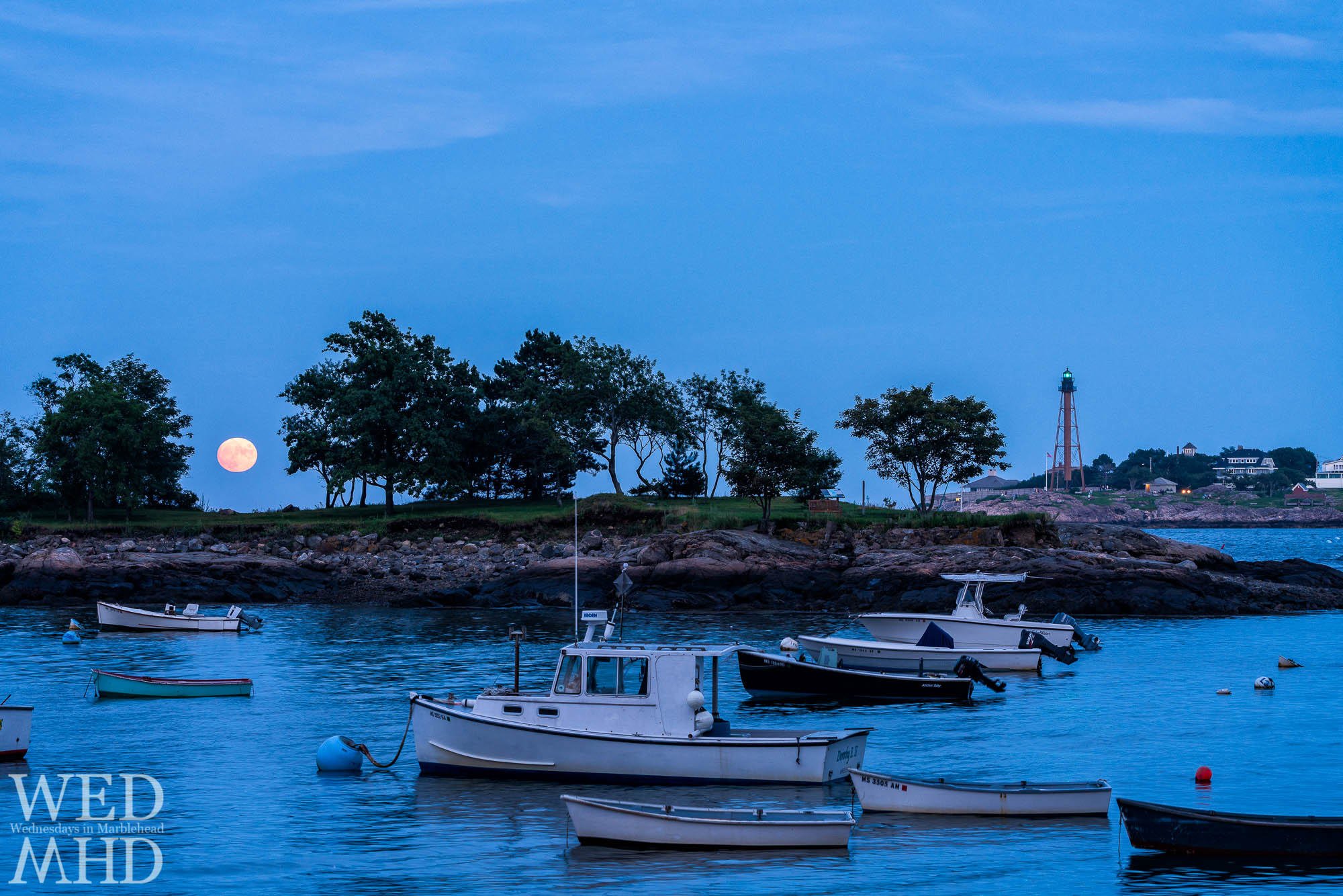 Tonight's blue moon rose against a blue sky over Gerry Island and boats moored in Little Harbor in Marblehead's Barnegat neighborhood