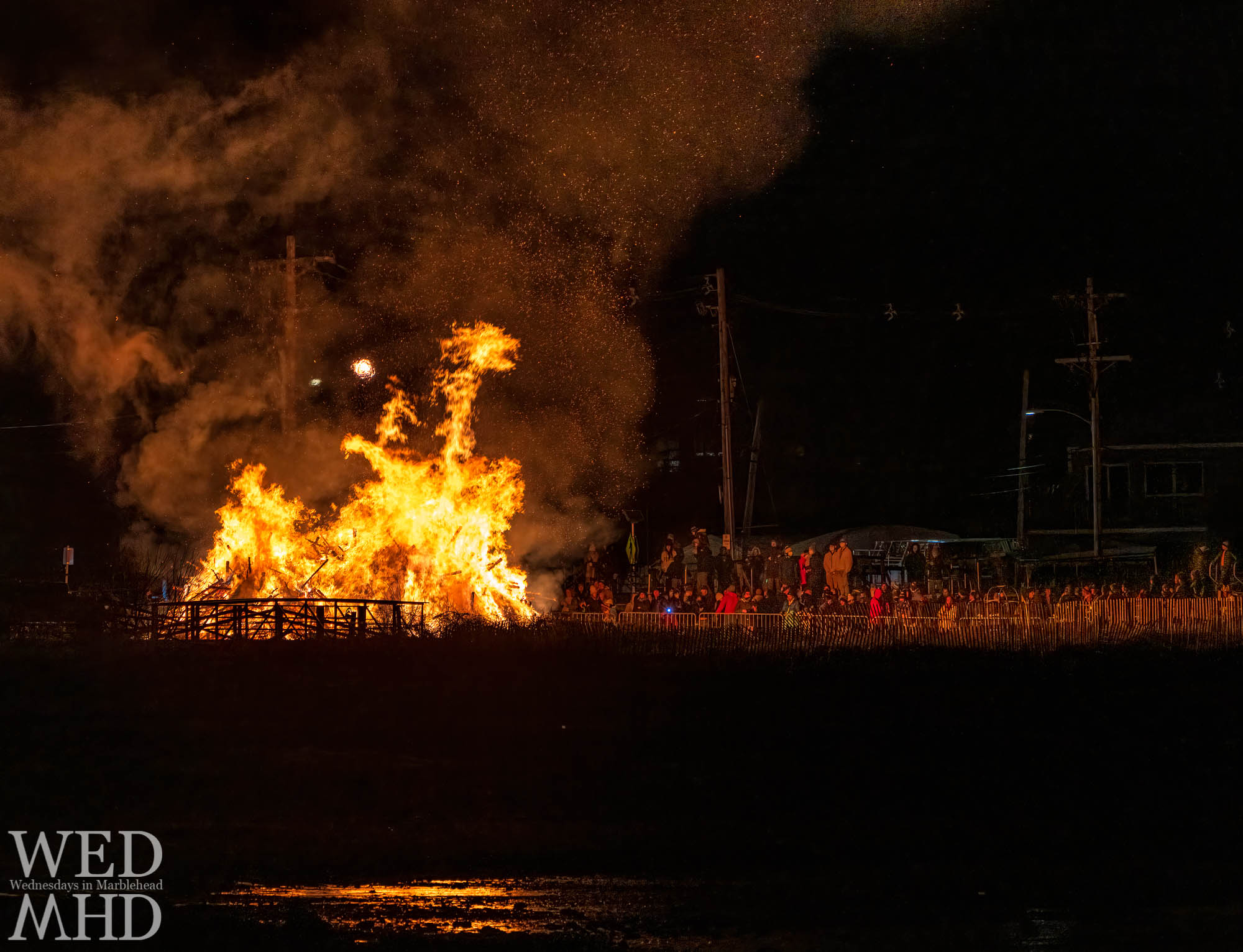 The annual Epiphany tree burning takes on the shape of a dragon breathing out sparks above the gathered crowd